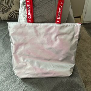 Clinique Metallic Silver Tote with Red Handles